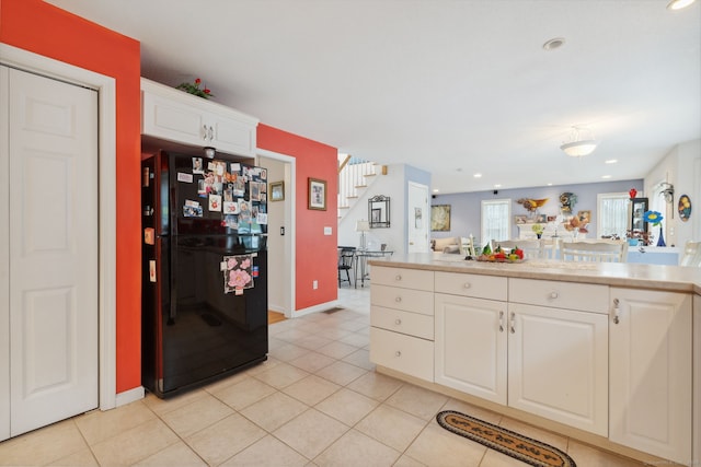 63 Old Cider Mill Rd, Southington, CT 06489 - kitchen with freestanding refrigerator, white cabinetry, light countertops, light tile patterned floors, and recessed lighting