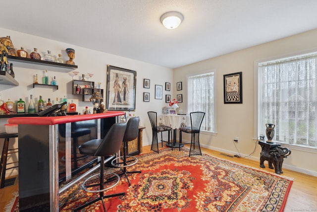 63 Old Cider Mill Rd, Southington, CT 06489 - office featuring a bar, wood finished floors, plenty of natural light, and baseboards