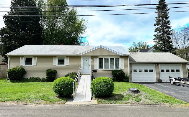 100 Arcadia Ave, Stratford, CT 06614 - ranch-style house featuring an attached garage, asphalt driveway, and a front lawn