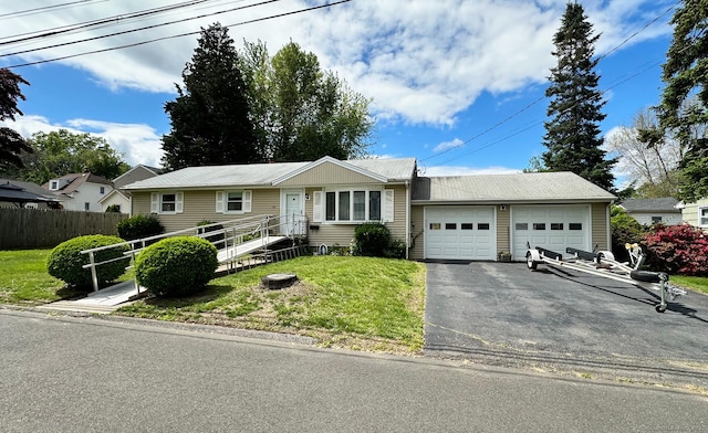 100 Arcadia Ave, Stratford, CT 06614 - single story home featuring asphalt driveway and a garage