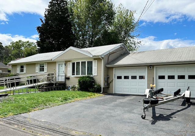 100 Arcadia Ave, Stratford, CT 06614 - ranch-style home featuring an attached garage and asphalt driveway