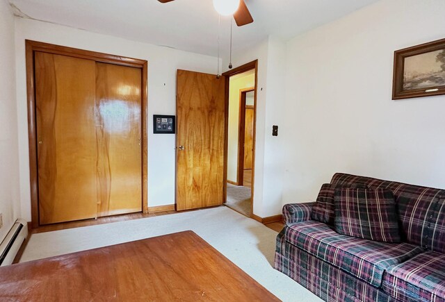 100 Arcadia Ave, Stratford, CT 06614 - living area featuring carpet flooring, ceiling fan, baseboard heating, and baseboards
