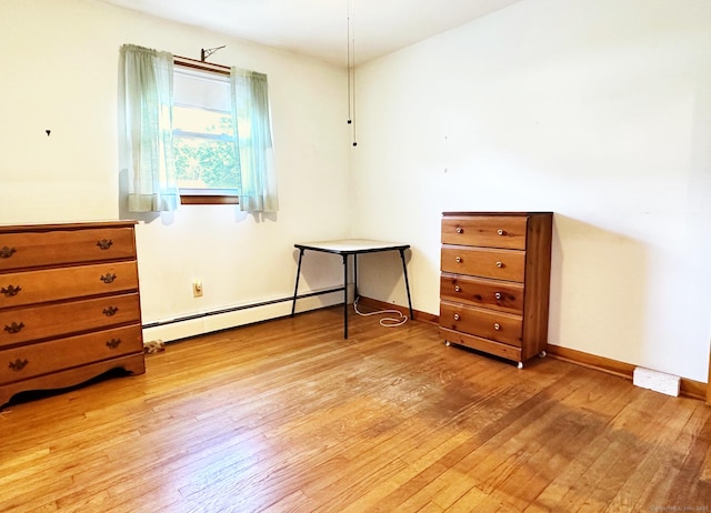 100 Arcadia Ave, Stratford, CT 06614 - bedroom featuring a baseboard radiator, light wood-style floors, and baseboards