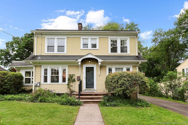 33 Bellevue Pl, Middletown, CT 06457 - view of front of home with a front lawn and a chimney
