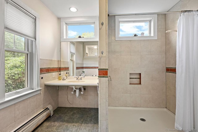 33 Bellevue Pl, Middletown, CT 06457 - bathroom featuring baseboard heating, a stall shower, plenty of natural light, and tile walls
