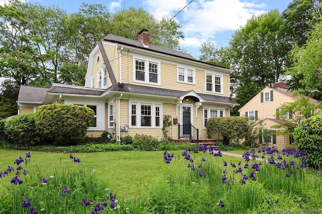 33 Bellevue Pl, Middletown, CT 06457 - dutch colonial featuring a front yard, a chimney, and a gambrel roof