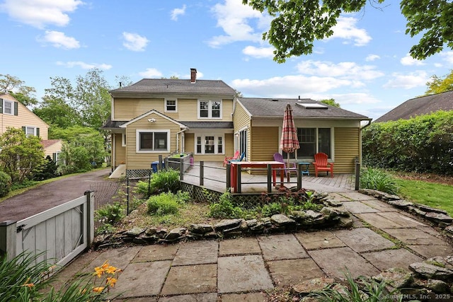 33 Bellevue Pl, Middletown, CT 06457 - rear view of property featuring a wooden deck and a chimney