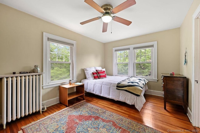33 Bellevue Pl, Middletown, CT 06457 - bedroom with radiator heating unit, wood finished floors, baseboards, and a ceiling fan