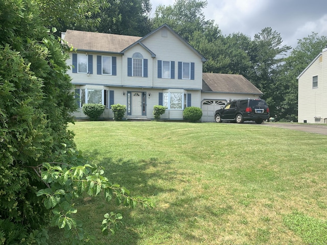 58 Amanda Cir, Windsor, CT 06095 - colonial home with a garage, a front lawn, a shingled roof, and asphalt driveway