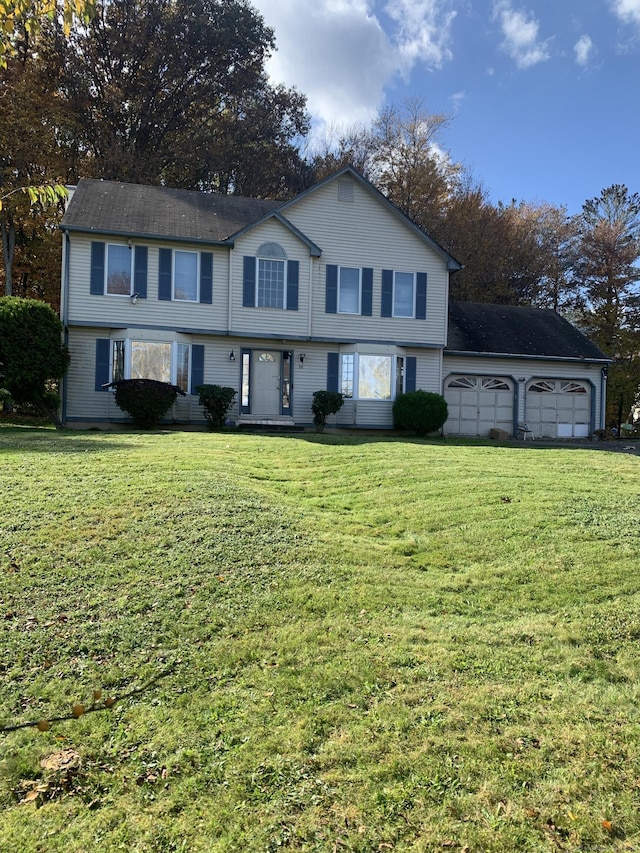 58 Amanda Cir, Windsor, CT 06095 - view of front facade featuring a garage and a front lawn