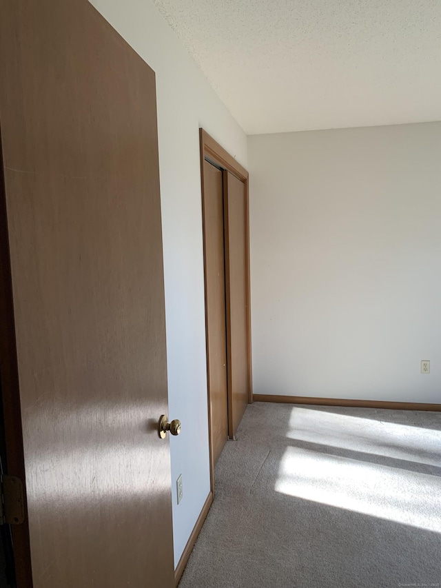 58 Amanda Cir, Windsor, CT 06095 - unfurnished bedroom with carpet floors and baseboards