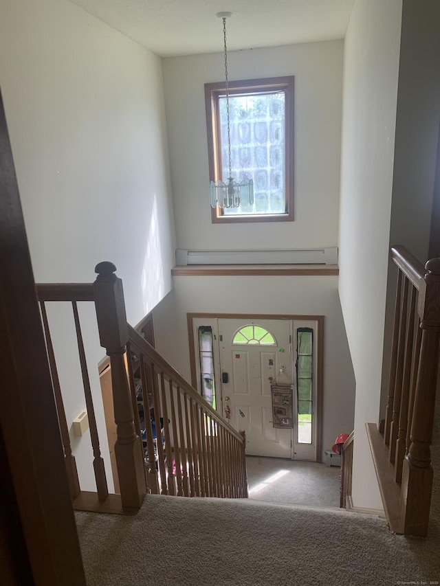 58 Amanda Cir, Windsor, CT 06095 - foyer with carpet floors, healthy amount of natural light, a baseboard radiator, and stairway