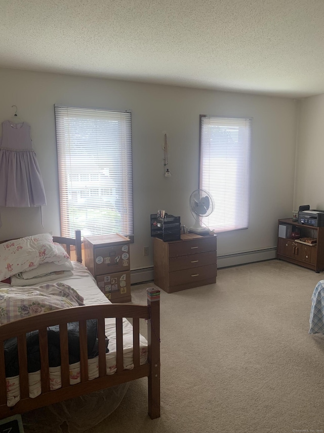 58 Amanda Cir, Windsor, CT 06095 - bedroom featuring baseboard heating, light carpet, and a textured ceiling