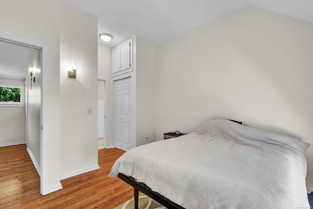 4 Pepperidge Ct Unit 4, Simsbury, CT 06070 - bedroom featuring light wood finished floors, baseboards, vaulted ceiling, and a closet