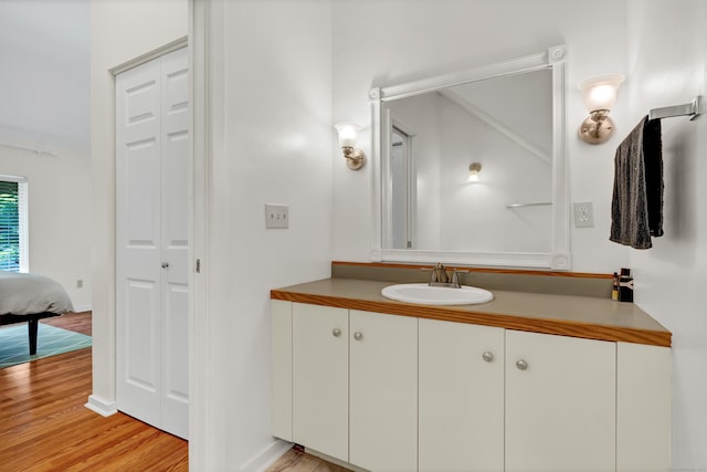 4 Pepperidge Ct Unit 4, Simsbury, CT 06070 - bathroom featuring vanity, wood finished floors, and a closet