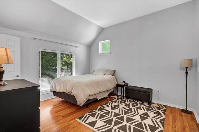 4 Pepperidge Ct Unit 4, Simsbury, CT 06070 - bedroom with access to outside, wood finished floors, lofted ceiling, and baseboards