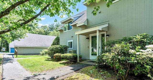 4 Pepperidge Ct Unit 4, Simsbury, CT 06070 - doorway to property featuring roof with shingles