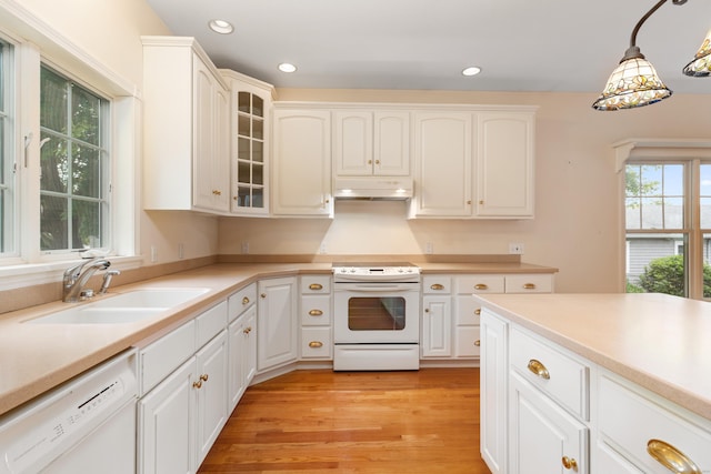8 Wadsworth Ln, Waterford, CT 06385 - kitchen featuring white appliances, a sink, under cabinet range hood, glass insert cabinets, and pendant lighting