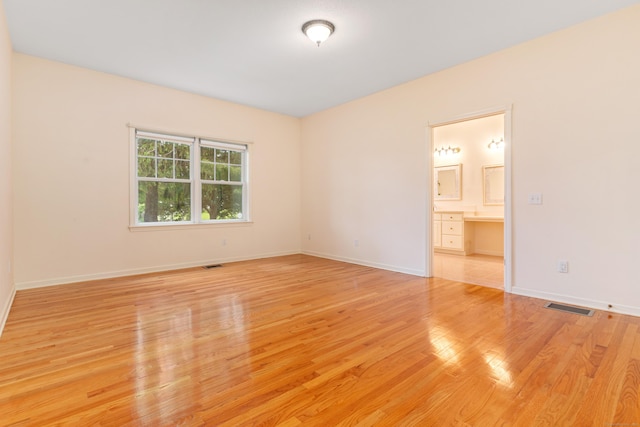 8 Wadsworth Ln, Waterford, CT 06385 - spare room with light wood-type flooring and baseboards