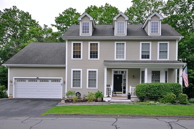 25 Traditions Blvd Unit 25, Southbury, CT 06488 - view of front of home with asphalt driveway, a garage, a shingled roof, and a front lawn