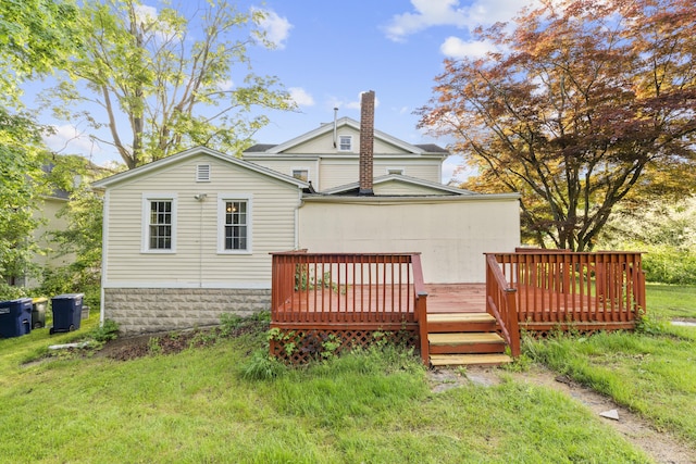 19 Elm St, Ansonia, CT 06401 - rear view of house featuring a wooden deck and a lawn