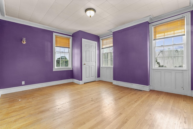 19 Elm St, Ansonia, CT 06401 - unfurnished bedroom featuring multiple windows, wood finished floors, crown molding, and baseboards