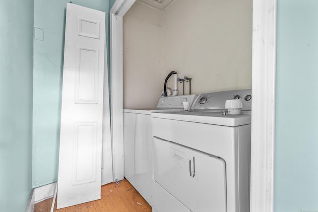 19 Elm St, Ansonia, CT 06401 - laundry area with washing machine and dryer and light wood finished floors