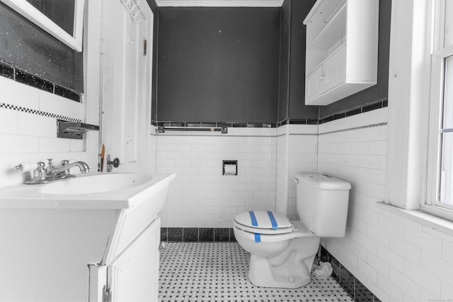19 Elm St, Ansonia, CT 06401 - half bath with tile walls, toilet, vanity, and tile patterned floors