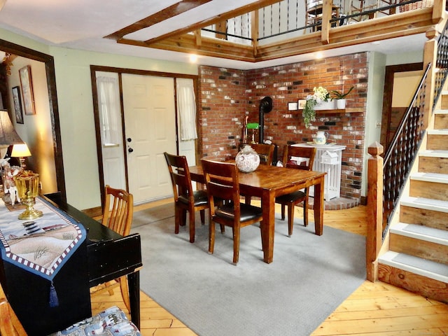 409 N Main St, Winchester, CT 06098 - dining area with stairs, wood-type flooring, and a wood stove
