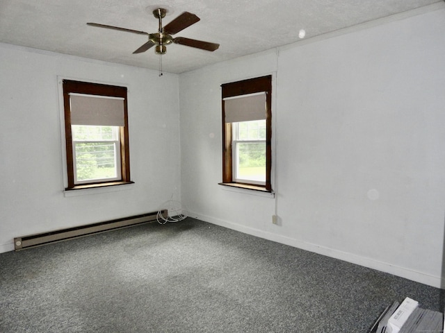 409 N Main St, Winchester, CT 06098 - carpeted empty room with plenty of natural light, a baseboard radiator, and a ceiling fan