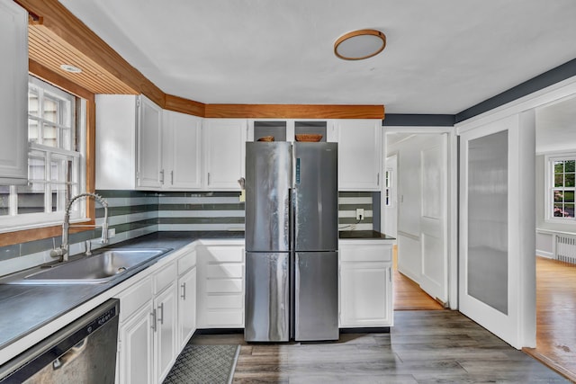 1815 Asylum Ave, West Hartford, CT 06117 - kitchen with freestanding refrigerator, dishwashing machine, white cabinetry, and dark countertops