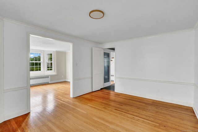 1815 Asylum Ave, West Hartford, CT 06117 - unfurnished room with radiator, light wood-type flooring, and ornamental molding