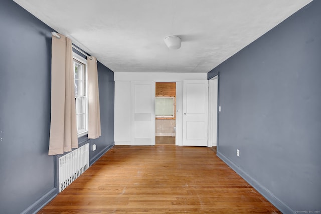 1815 Asylum Ave, West Hartford, CT 06117 - spare room with radiator heating unit and light wood-type flooring