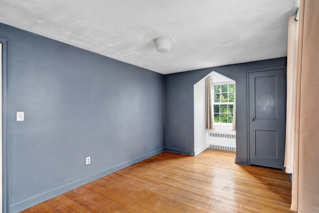 1815 Asylum Ave, West Hartford, CT 06117 - empty room with radiator and wood finished floors