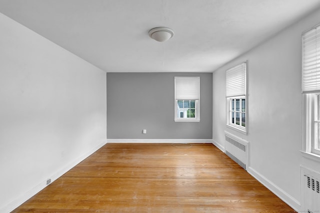 1815 Asylum Ave, West Hartford, CT 06117 - empty room featuring radiator heating unit and light wood-style floors