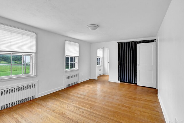 1815 Asylum Ave, West Hartford, CT 06117 - unfurnished room with radiator heating unit and light wood finished floors