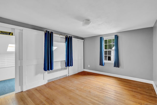 1815 Asylum Ave, West Hartford, CT 06117 - unfurnished room featuring radiator and wood finished floors