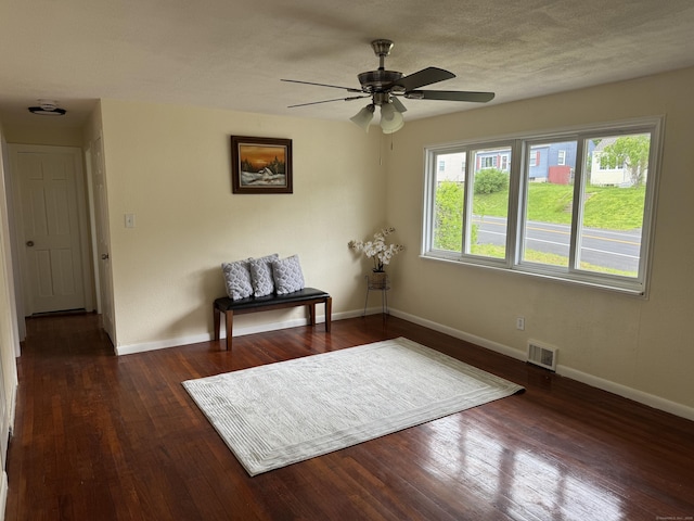 256 Alexander Rd, New Britain, CT 06053 - living area featuring baseboards, dark wood finished floors, and a ceiling fan