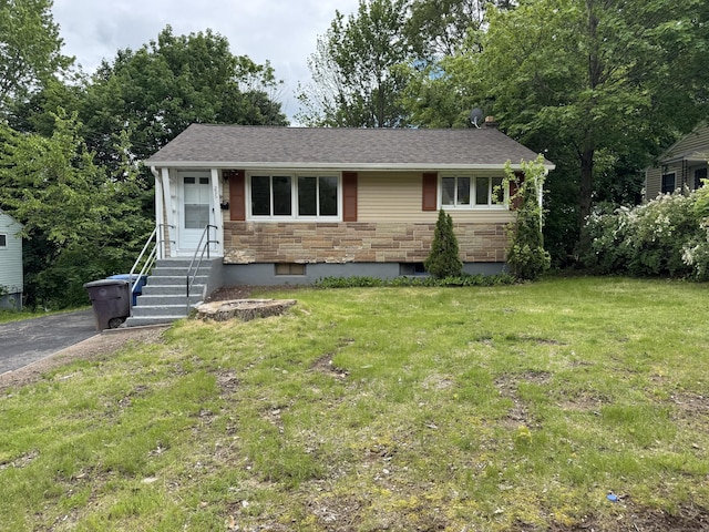 256 Alexander Rd, New Britain, CT 06053 - view of front of property featuring a front yard, stone siding, and roof with shingles