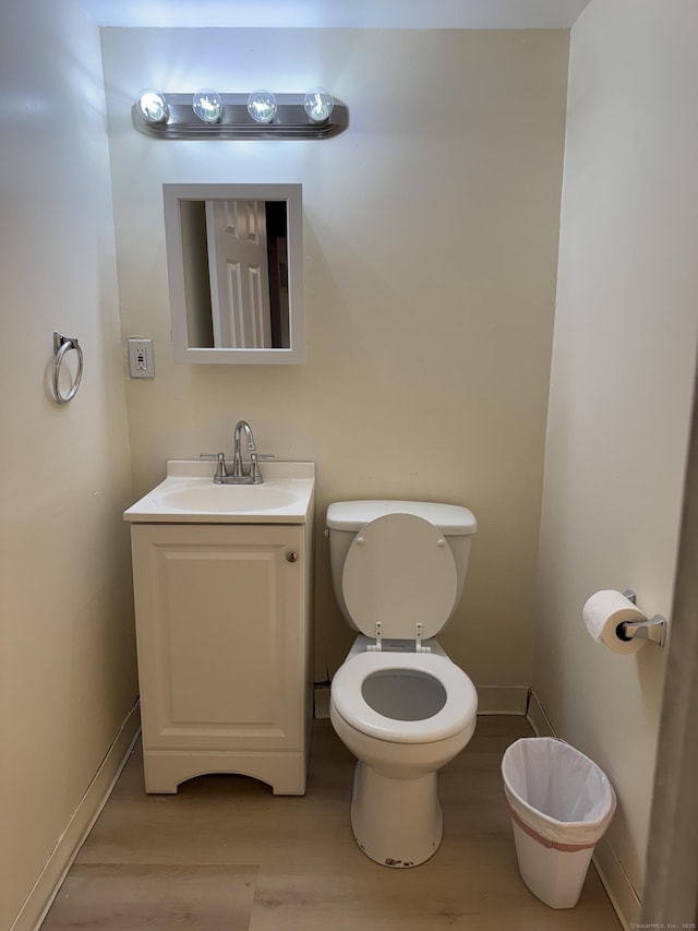 256 Alexander Rd, New Britain, CT 06053 - bathroom featuring vanity, wood finished floors, toilet, and baseboards