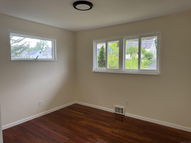 256 Alexander Rd, New Britain, CT 06053 - spare room with baseboards, healthy amount of natural light, and dark wood-style floors