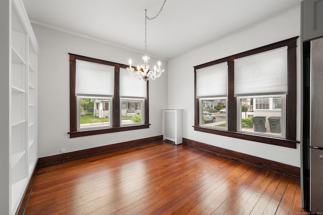 58 Gorton St, New London, CT 06320 - spare room featuring a chandelier, plenty of natural light, hardwood / wood-style floors, baseboards, and crown molding
