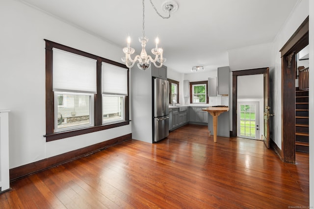 58 Gorton St, New London, CT 06320 - kitchen with freestanding refrigerator, gray cabinetry, a chandelier, light countertops, and dark wood-style flooring