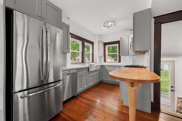 58 Gorton St, New London, CT 06320 - kitchen with stainless steel appliances, a sink, wooden counters, gray cabinets, and dark wood-style floors