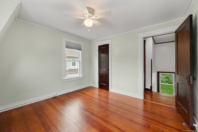 58 Gorton St, New London, CT 06320 - unfurnished bedroom with baseboards, hardwood / wood-style flooring, ornamental molding, and a ceiling fan