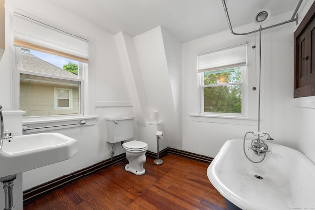 58 Gorton St, New London, CT 06320 - full bath with a soaking tub, wood finished floors, and toilet