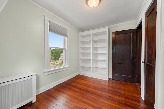 58 Gorton St, New London, CT 06320 - spare room with radiator heating unit, baseboards, wood-type flooring, and ornamental molding