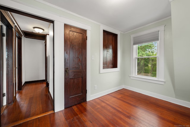 58 Gorton St, New London, CT 06320 - unfurnished bedroom featuring dark wood-style flooring, baseboards, and crown molding
