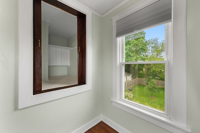 58 Gorton St, New London, CT 06320 - spare room featuring baseboards, ornamental molding, and dark wood-style floors