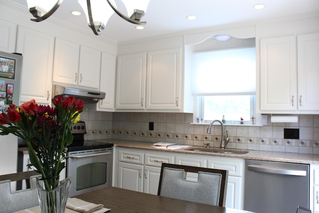 243 Courtland Ave, Waterbury, CT 06705 - kitchen with appliances with stainless steel finishes, a sink, under cabinet range hood, white cabinets, and backsplash